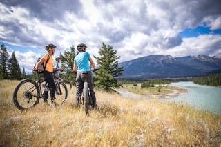 WT Finance Institute travellers cycling the Athabasca River near Jasper in Canada